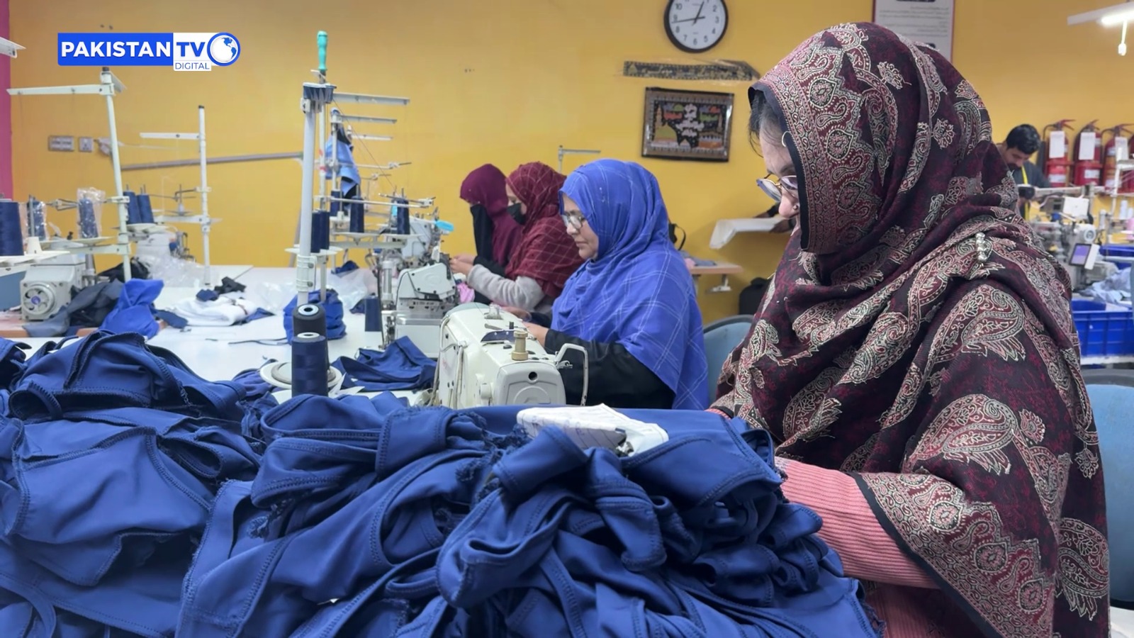 Women garment workers operate sewing machines at a textile unit in Faisalabad, the industrial hub of Pakistan, producing clothing for local and international markets